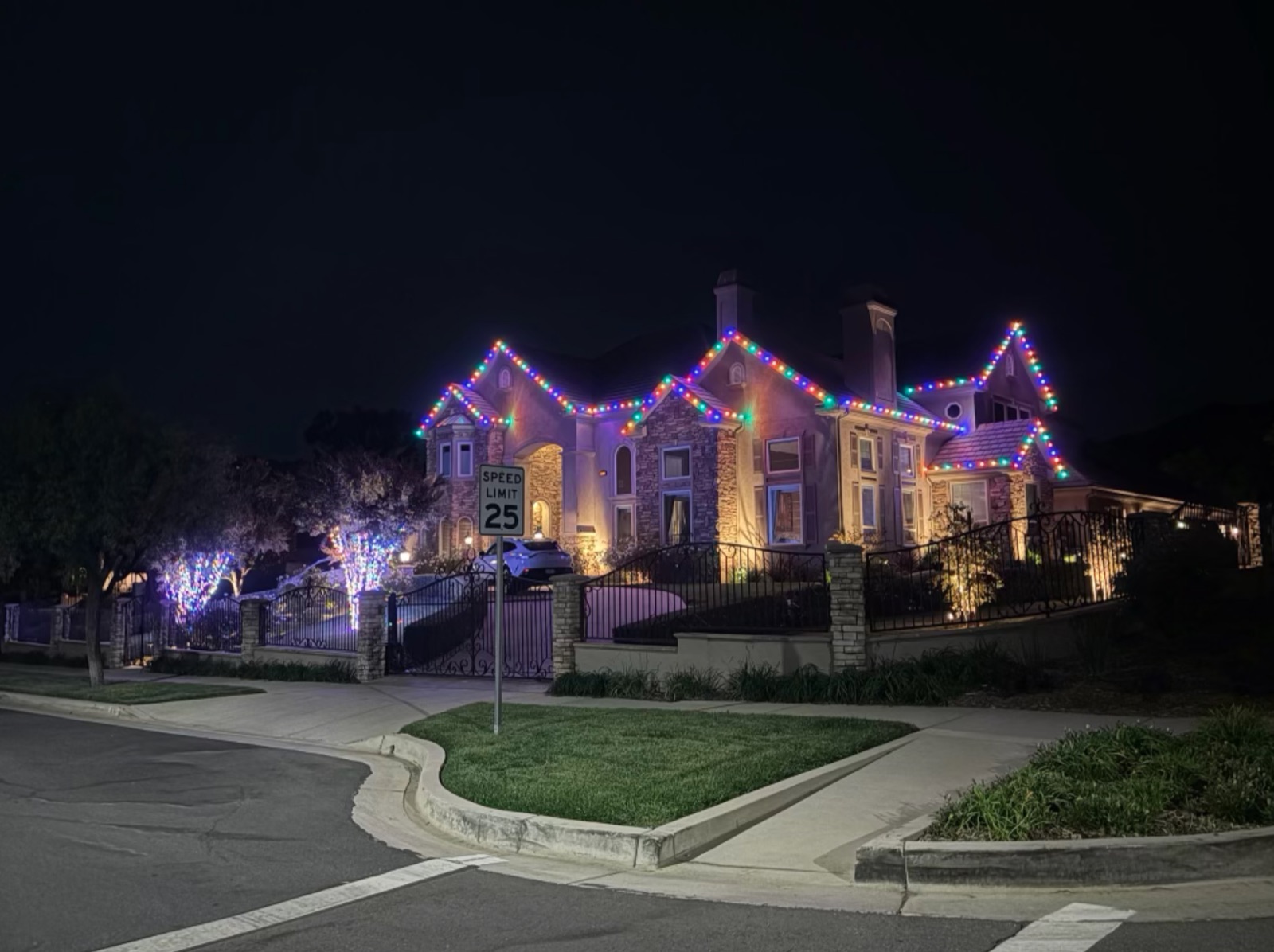 Multicolor roofline lights on a large home