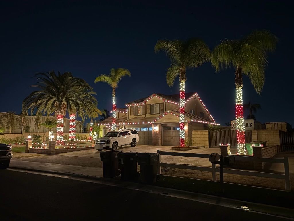 Four tall candy-cane striped palm wraps with a red and white roofline