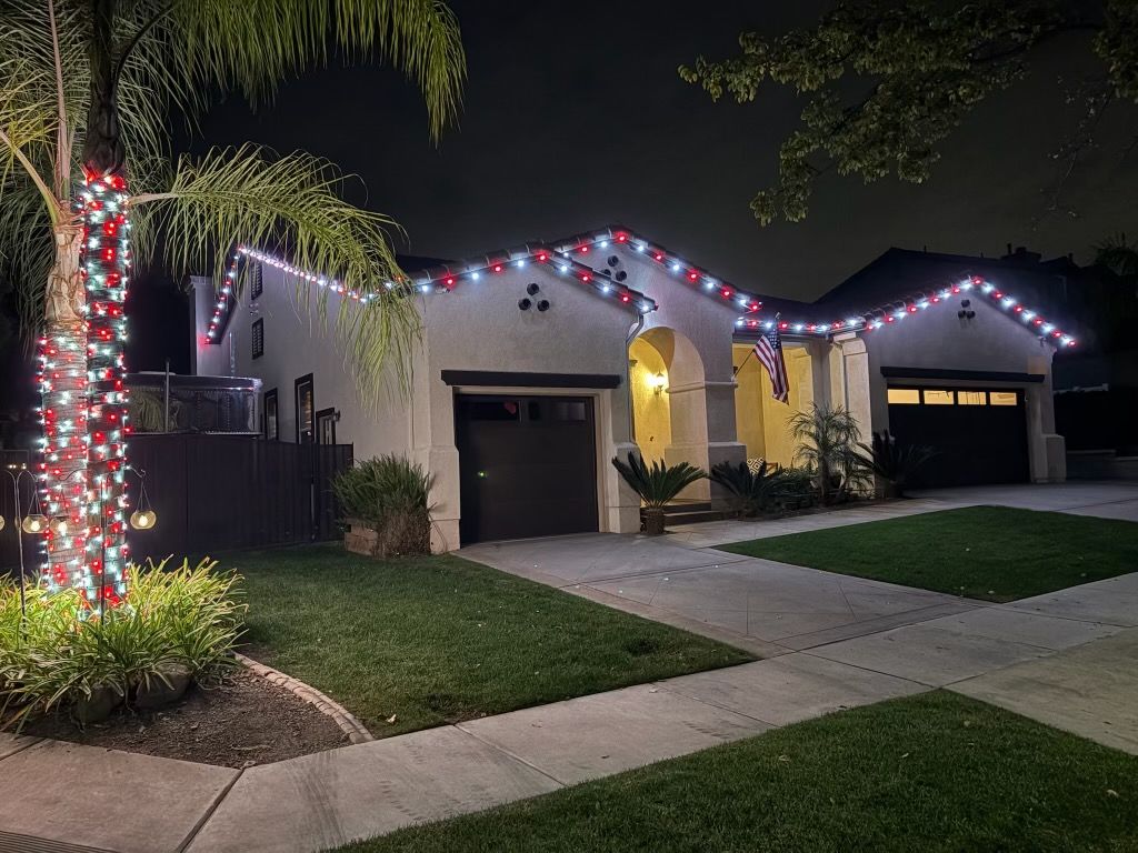 Red and cool white roofline with a candy-cane wrapped palm and hanging ornaments